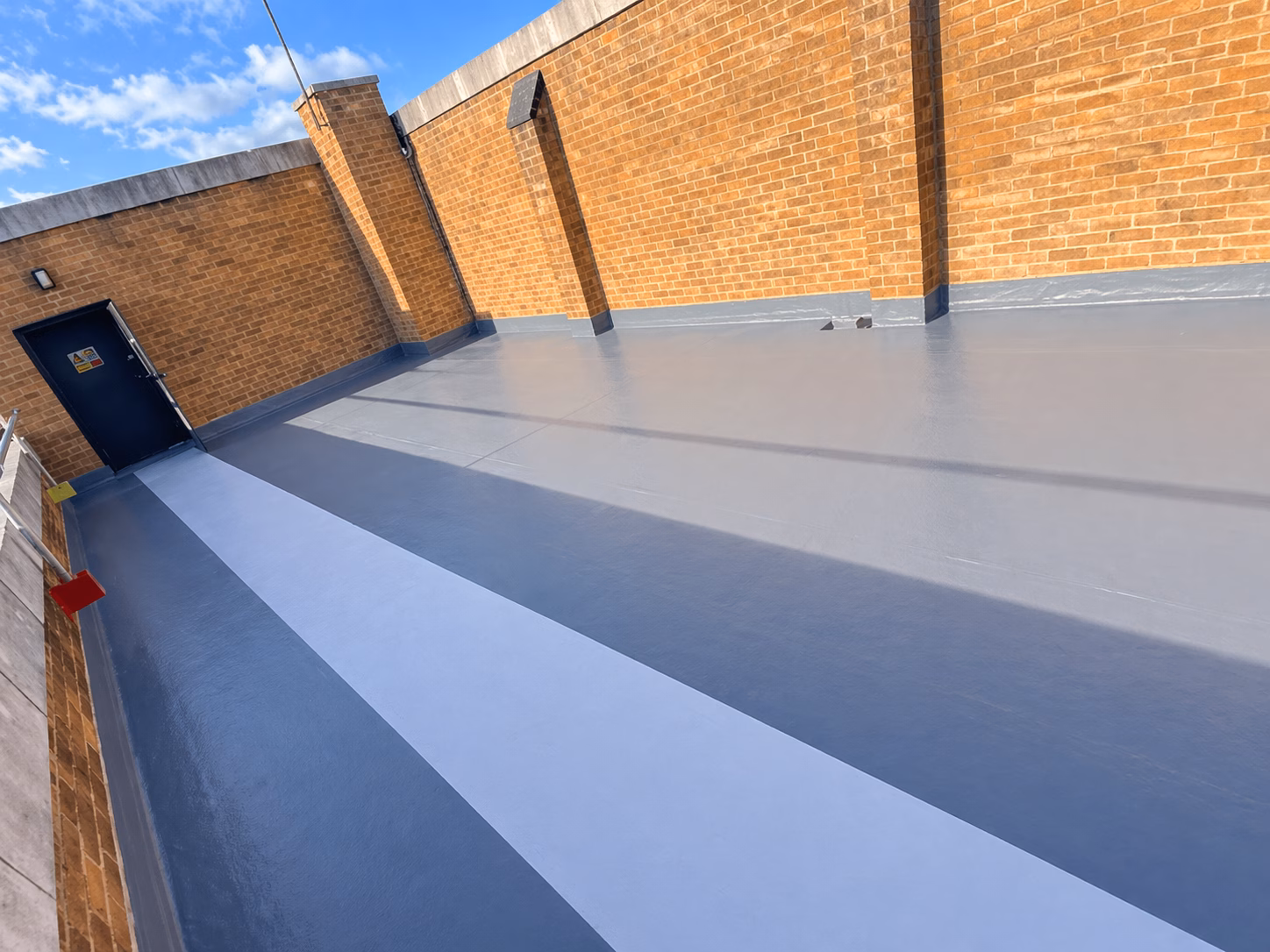 Hinckley – Liquid Roofing System Installation Hinckley liquid roofing installation with brick walls.
