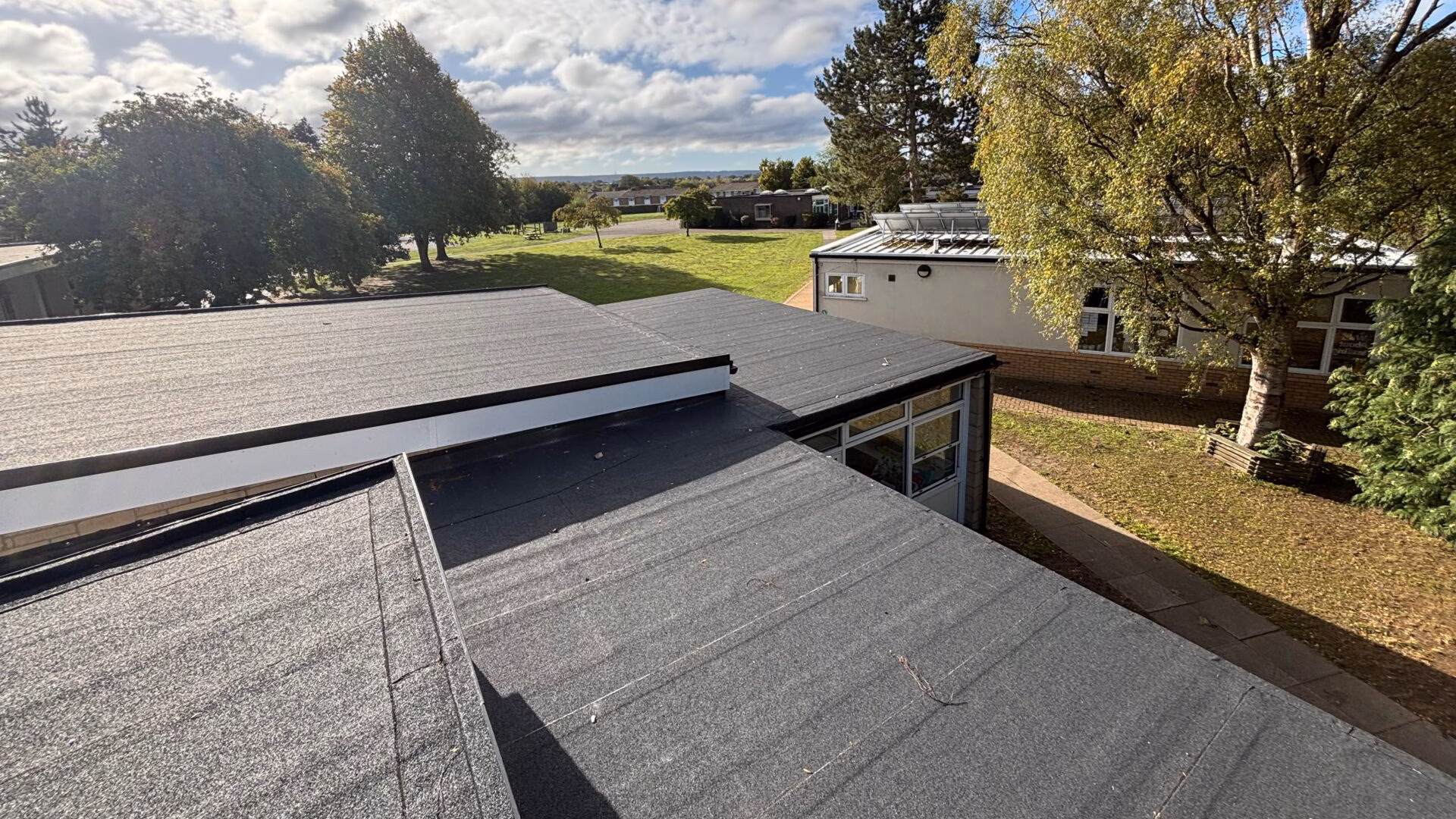 flat-felt-rooftop-with-multiple-levels Professional flat felt rooftop installation with multiple elevations.