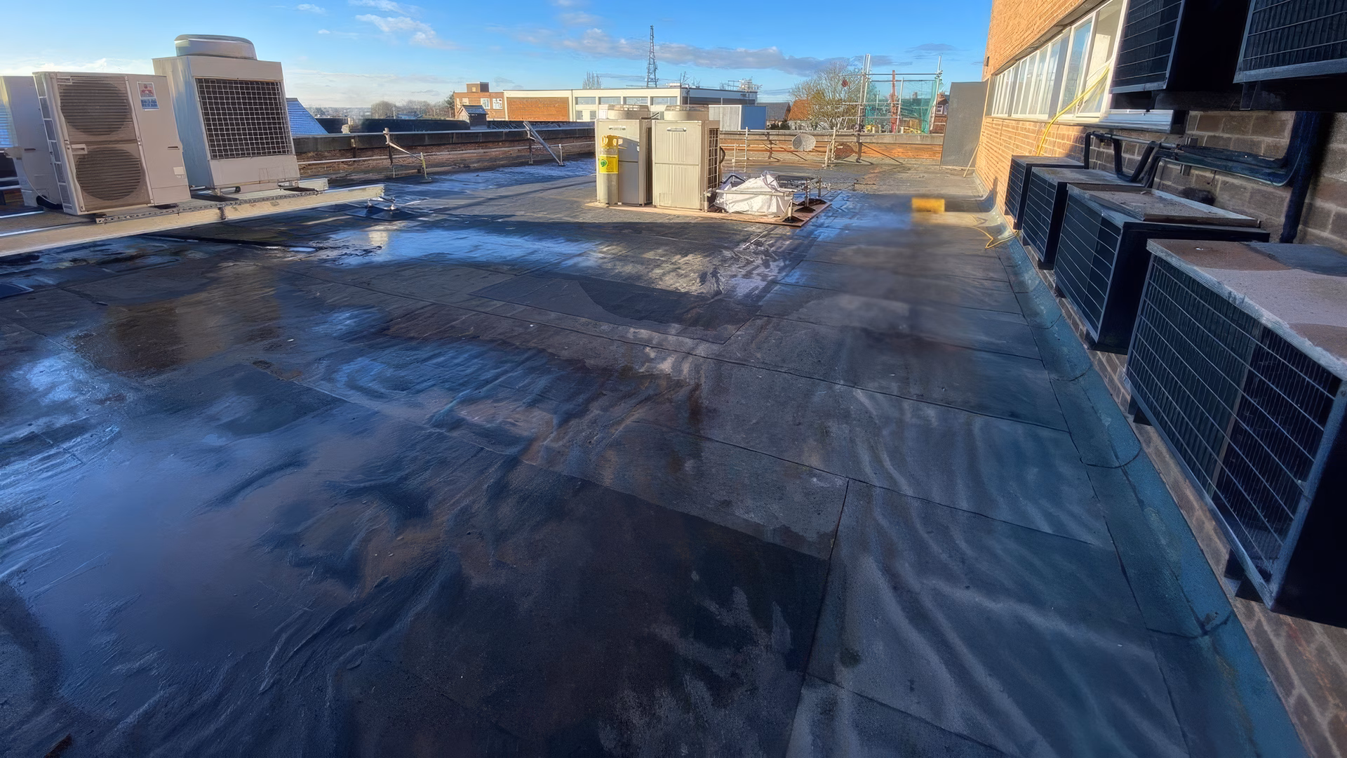 Initial inspection of the felt roofing to determine liquid overlay suitability
